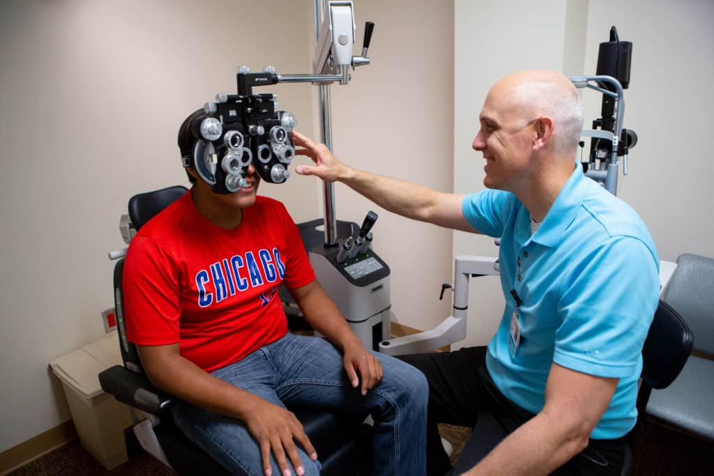 Doctor giving an eye exam